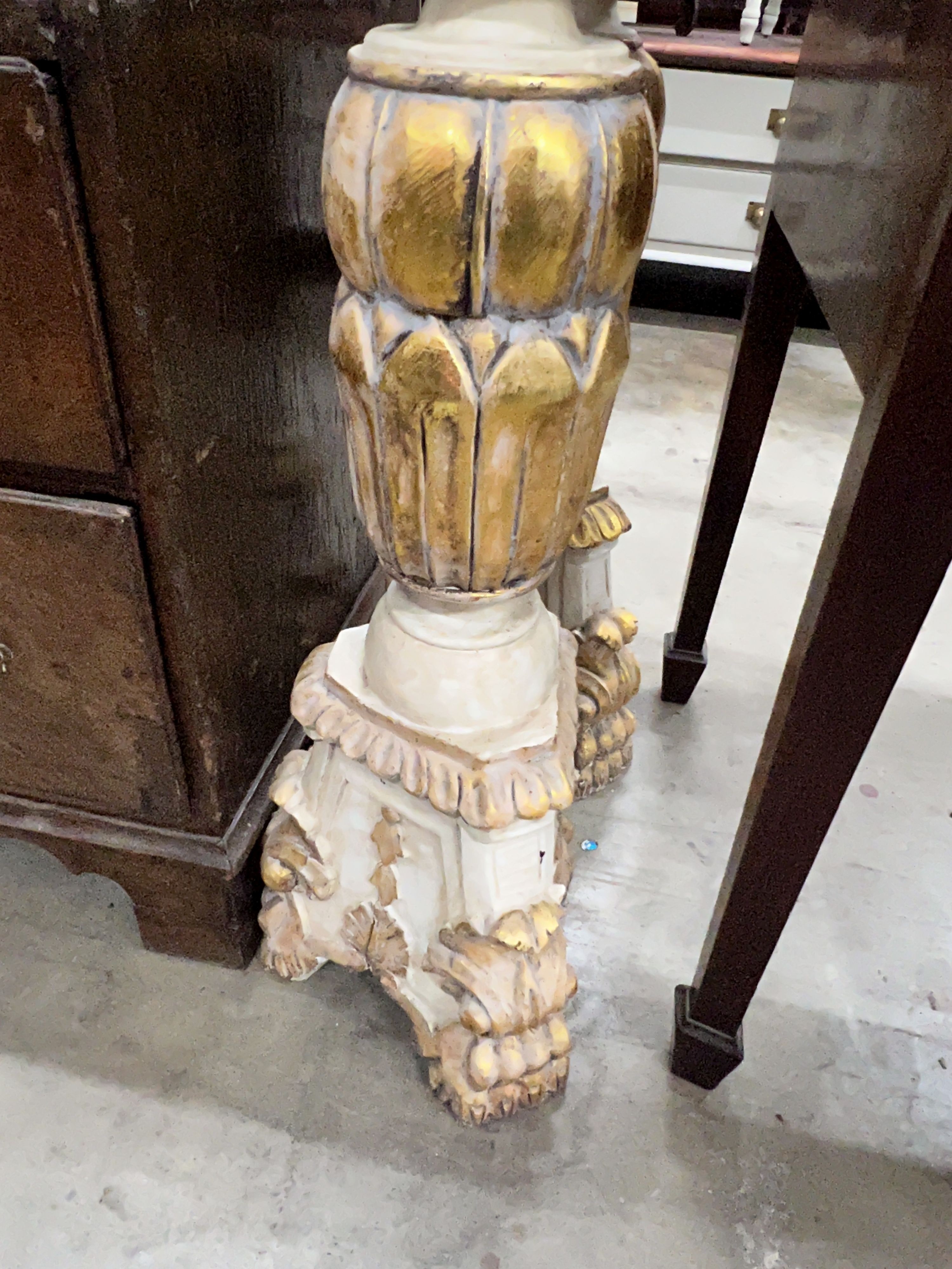 A pair of Italian style painted parcel gilt pricket candlesticks, height 150cm